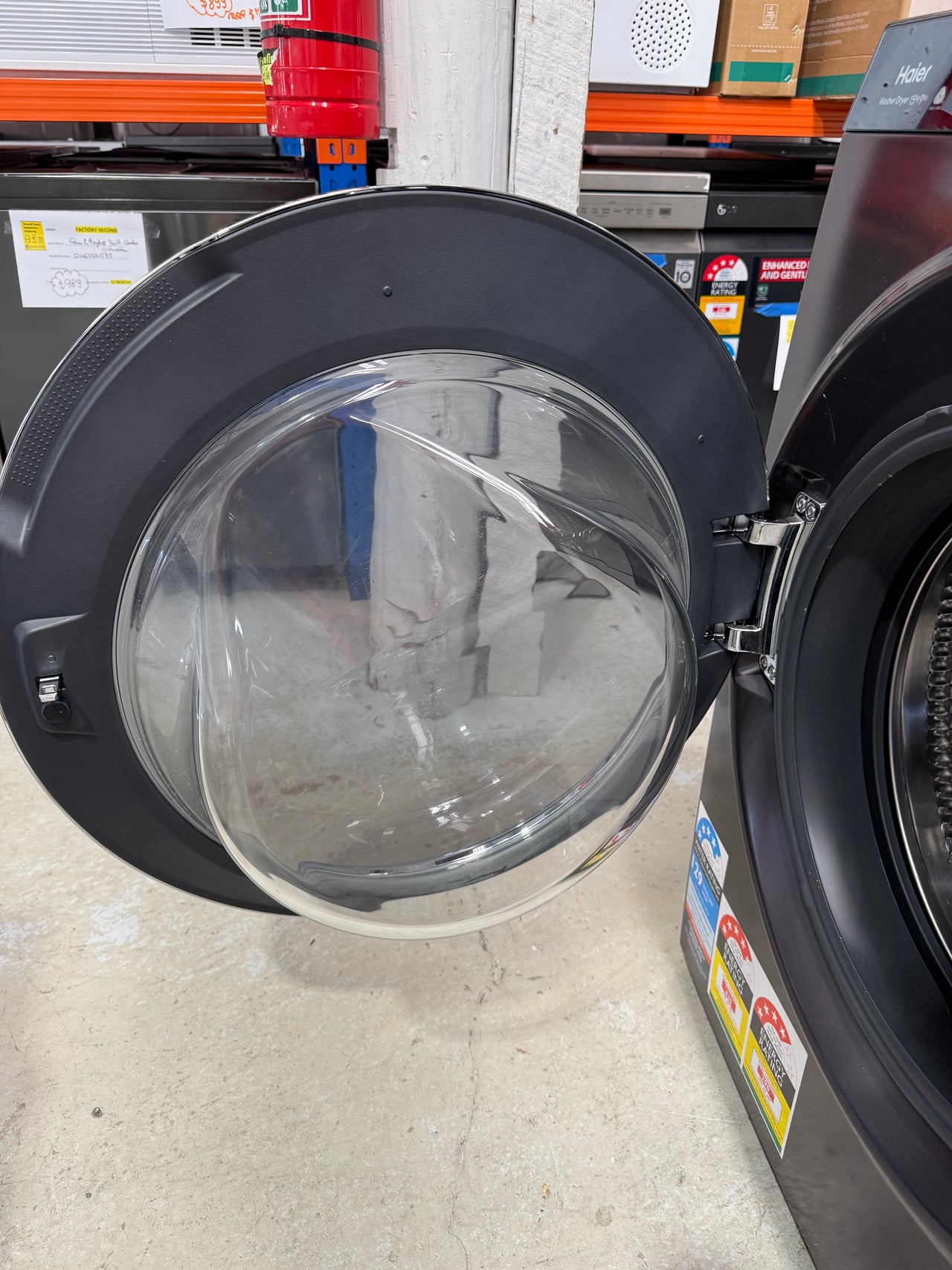 Factory second Haier HWDX1590CTB1 premium 2-in-1 front load washer dryer - Second Hand Appliances Geebung