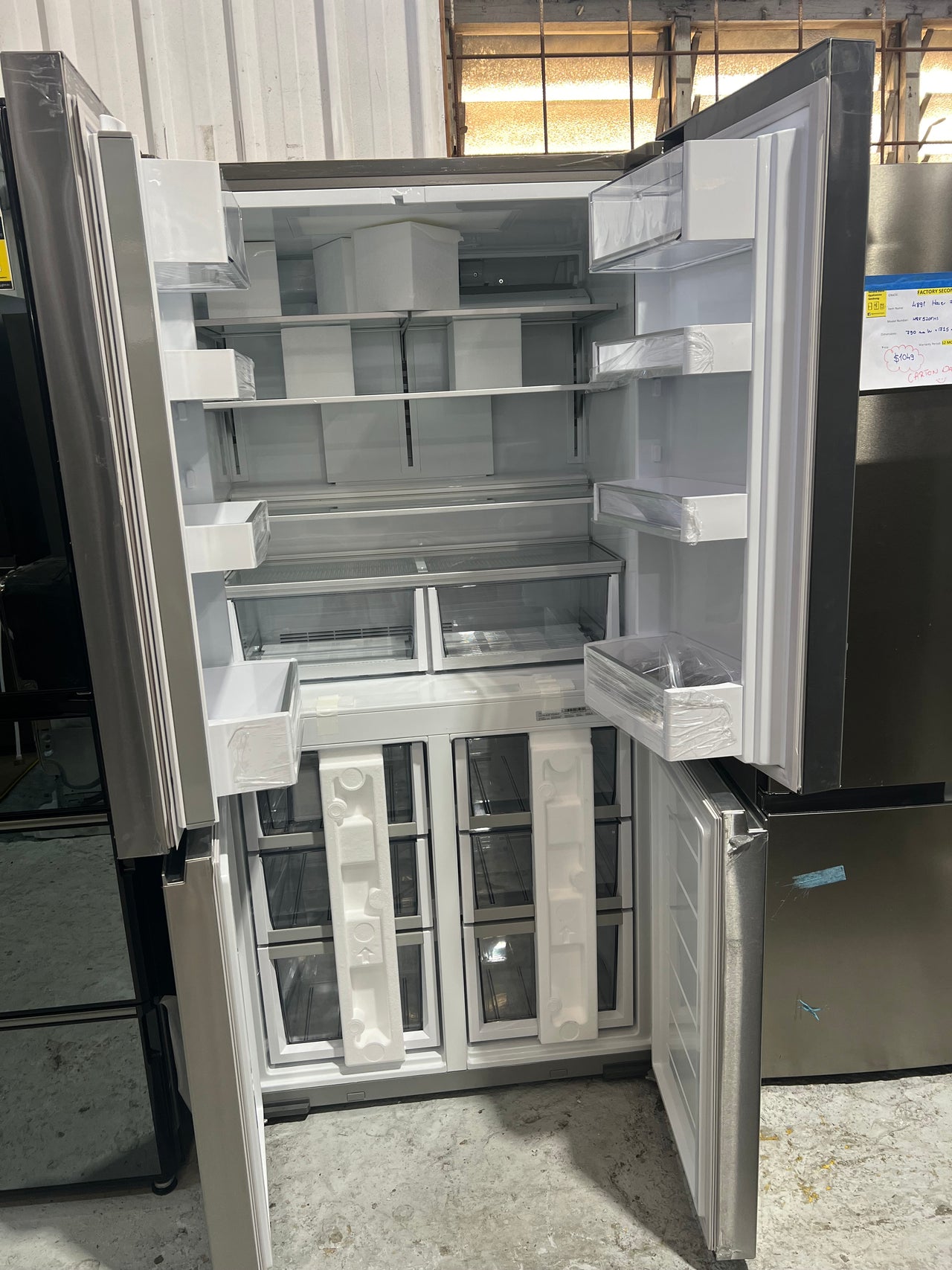 Transportation damaged Fisher & Paykel 538L Quad Door Refrigerator - Stainless Steel Model: RF605QNUVX1 - Second Hand Appliances Geebung