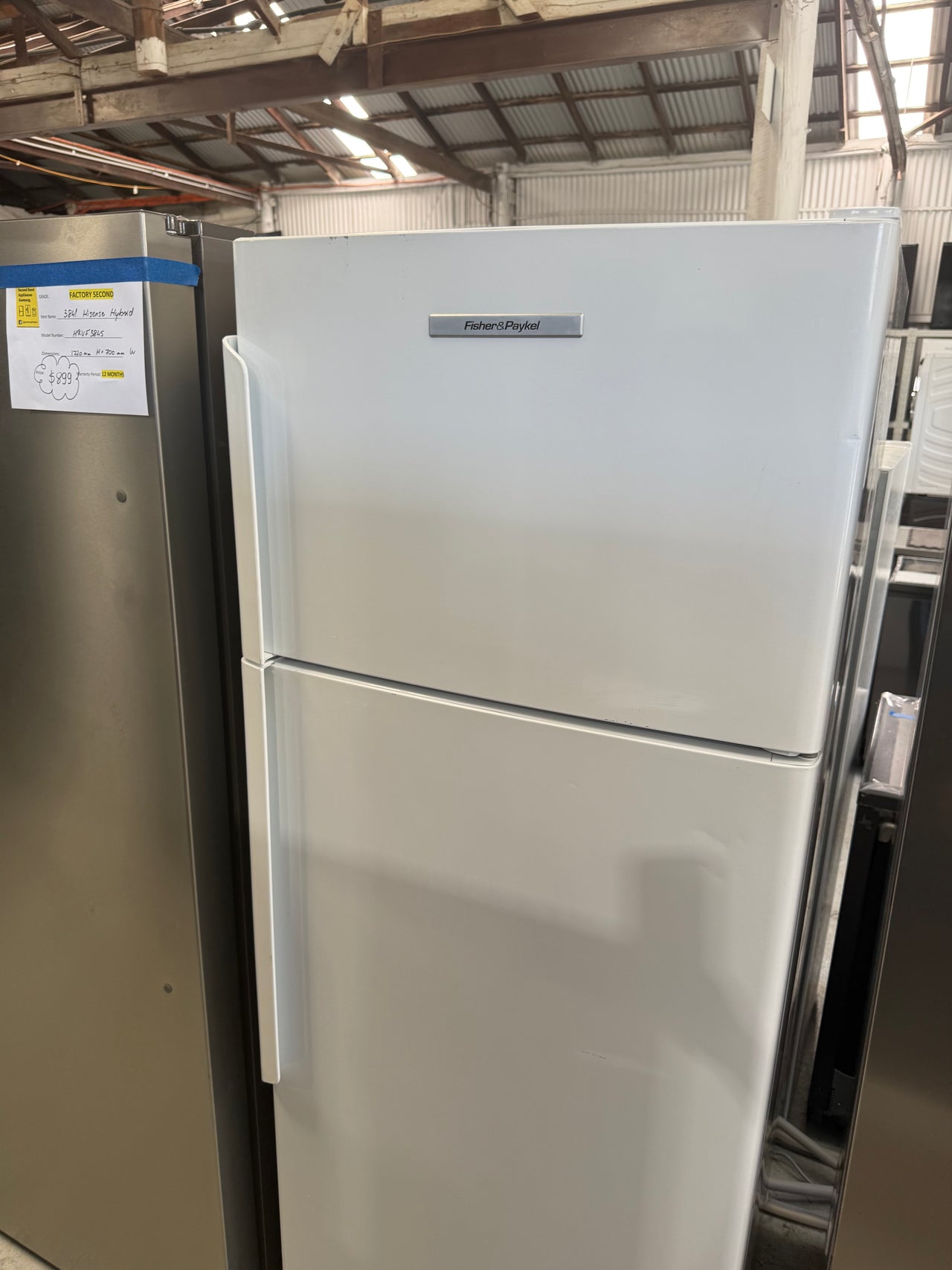 Second hand Fisher & Paykel E411TRT3 411-liter top-mount refrigerator