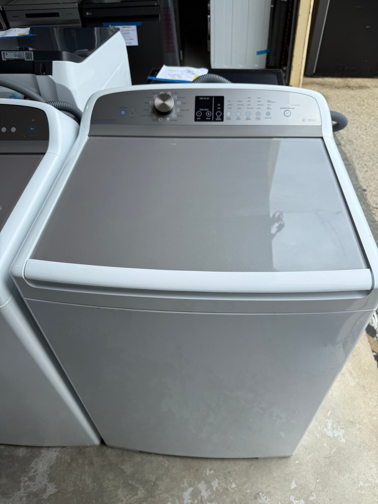 Second hand Fisher & Paykel WA1068P1  10kg top-loading washing machine