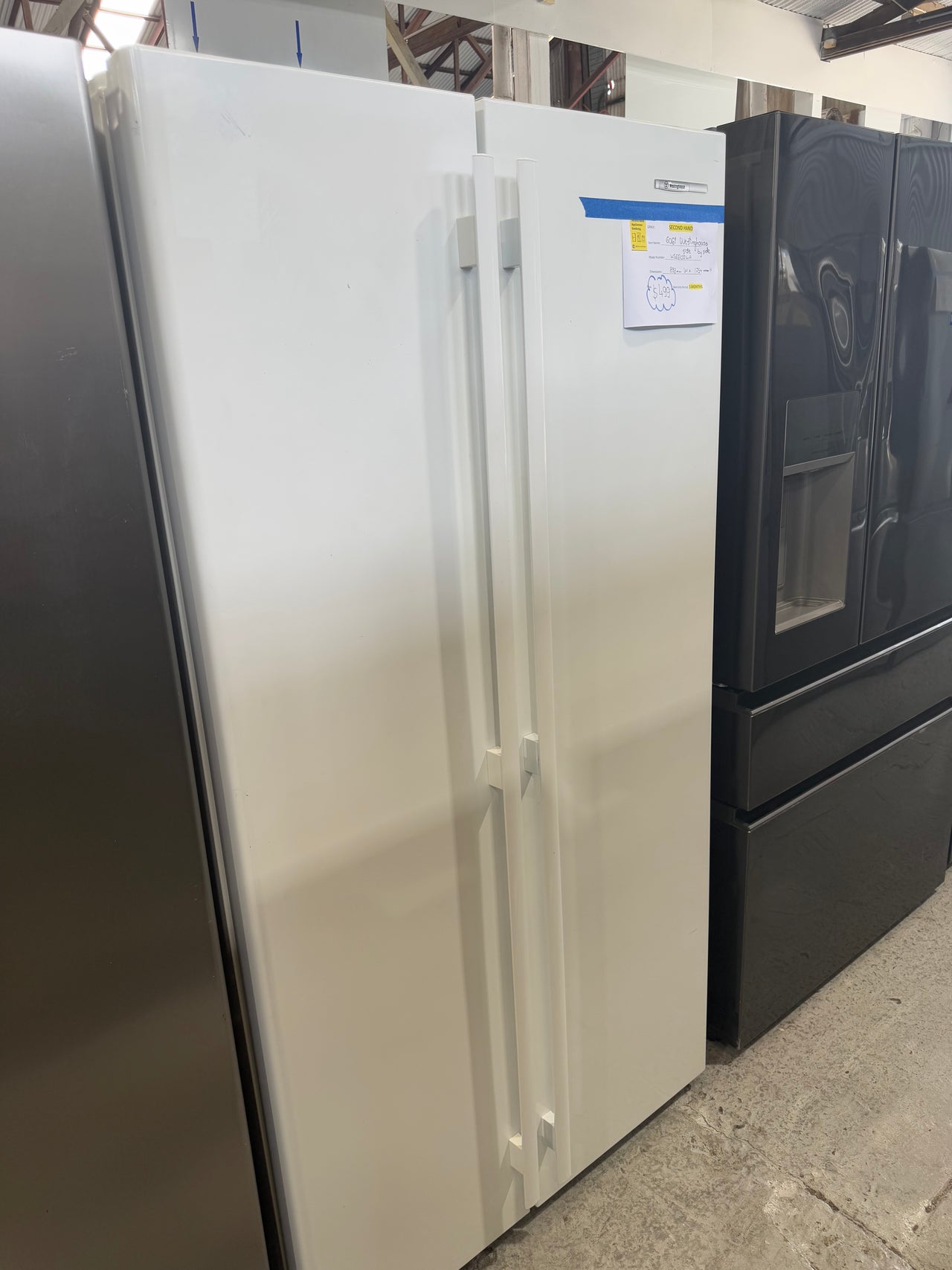 Second hand Westinghouse WSE6100WA 610-liter side-by-side refrigerator-freezer - Second Hand Appliances Geebung