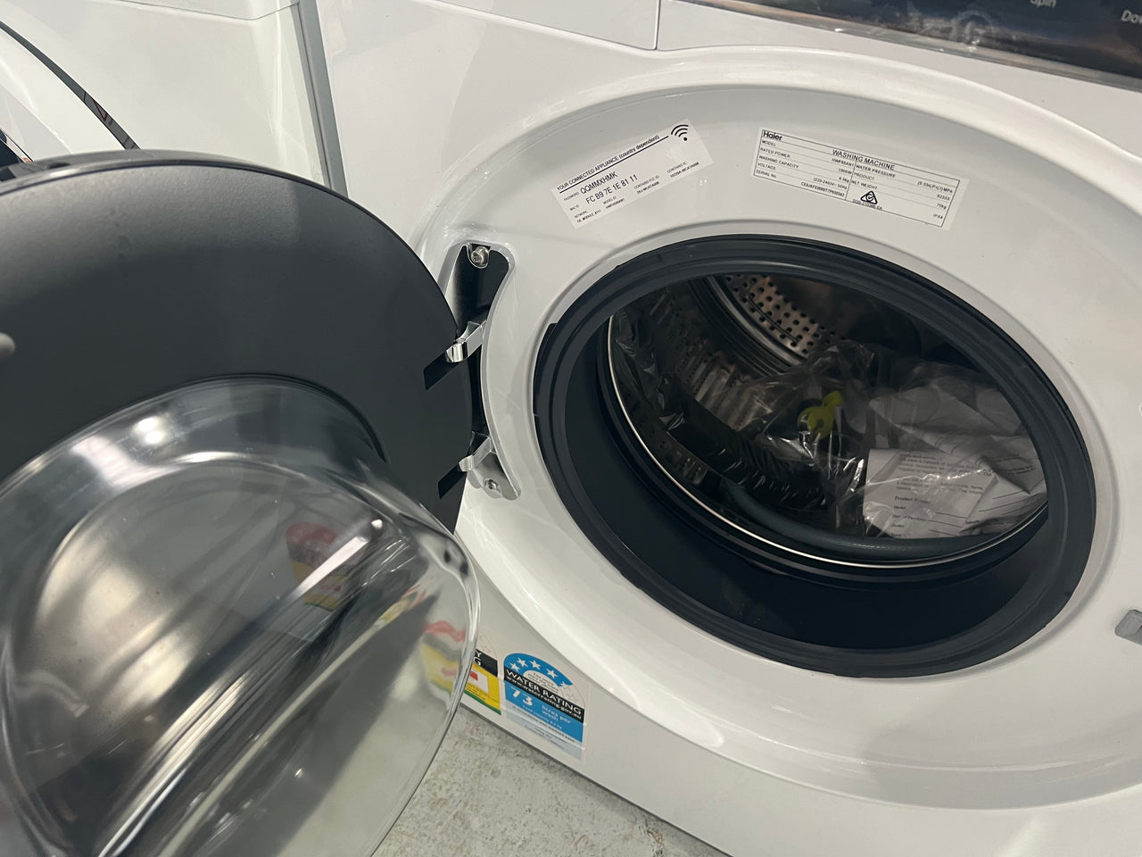 Transportation damaged 8,5 kg Haier front loader HWF85AN1 - Second Hand Appliances Geebung